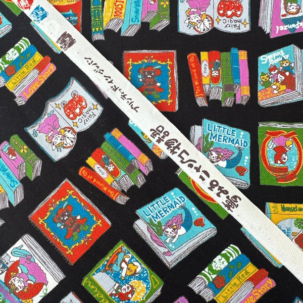 Selvage of Dreaming Cat Story Books cotton fabric in black, imported from Japan