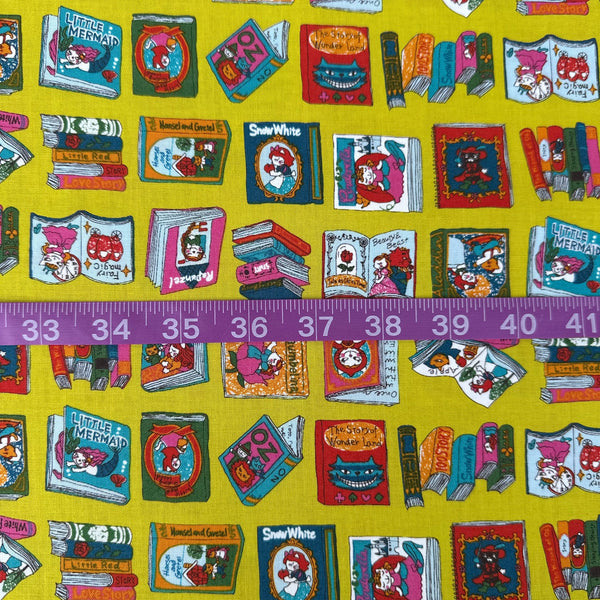 Scale of Dreaming Cat Story Books cotton fabric in chartreuse, imported from Japan