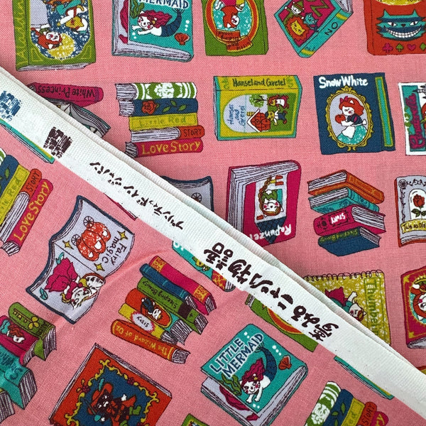 Selvage of Dreaming Cat Story Books cotton fabric in pink, imported from Japan