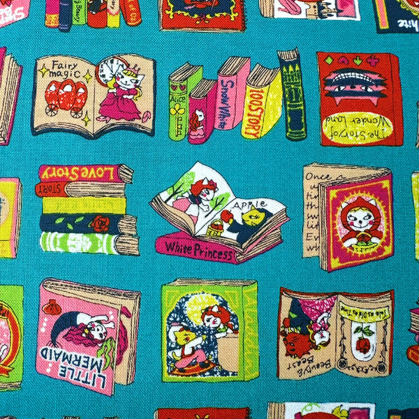 Close up of Dreaming Cat Story Books cotton fabric in teal, imported from Japan