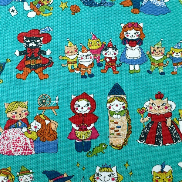 Close up of Dreaming Cat Story Characters cotton fabric in teal, imported from Japan