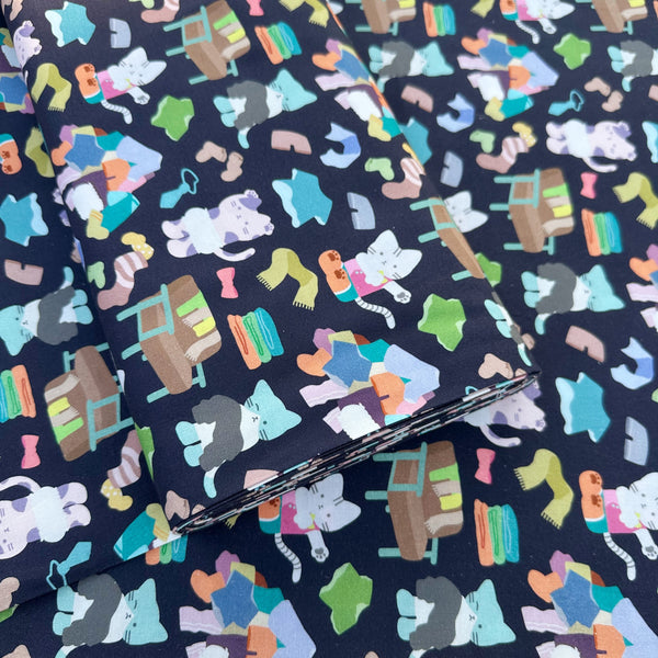 Bolt of Dressed Up Cats cotton fabric in midnight by Nora featuring cats with clothing and laundry illustrations imported from Japan