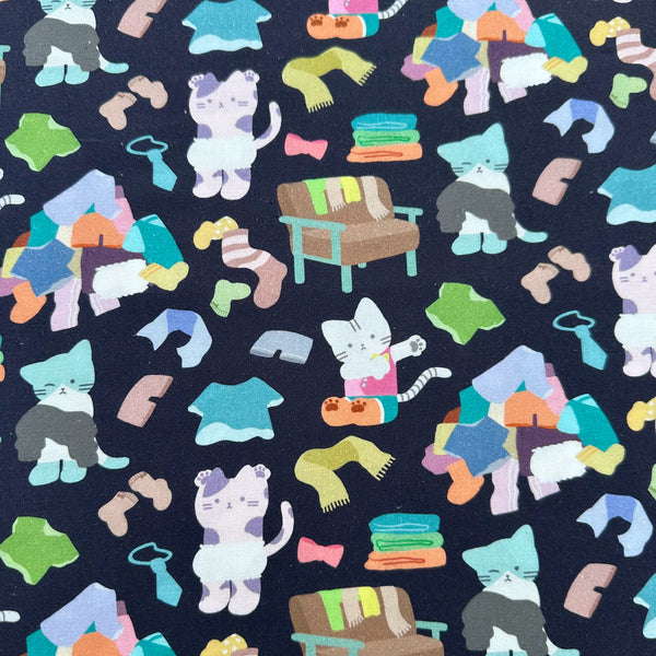 Dressed Up Cats cotton fabric in midnight by Nora featuring cats with clothing and laundry illustrations imported from Japan