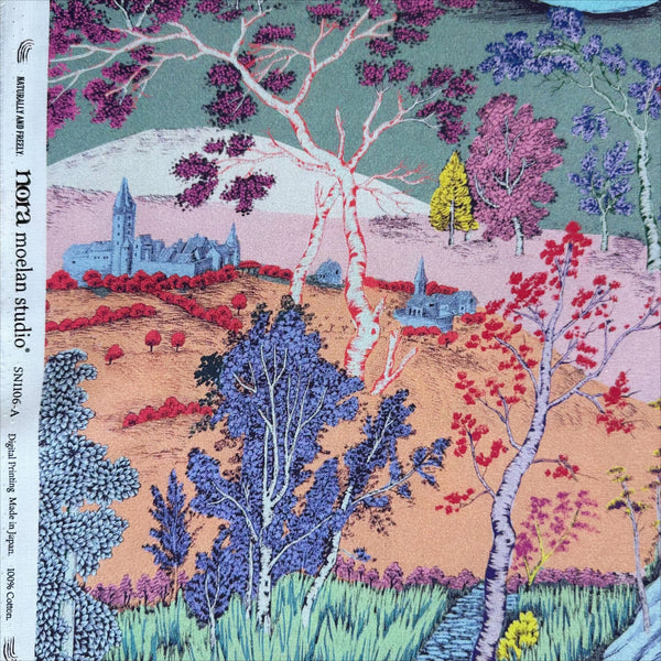 Selvage of Eden Panorama cotton fabric by Nora featuring a richly detailed landscape with a flowing river, dense forest, and vibrant colors, imported from Japan