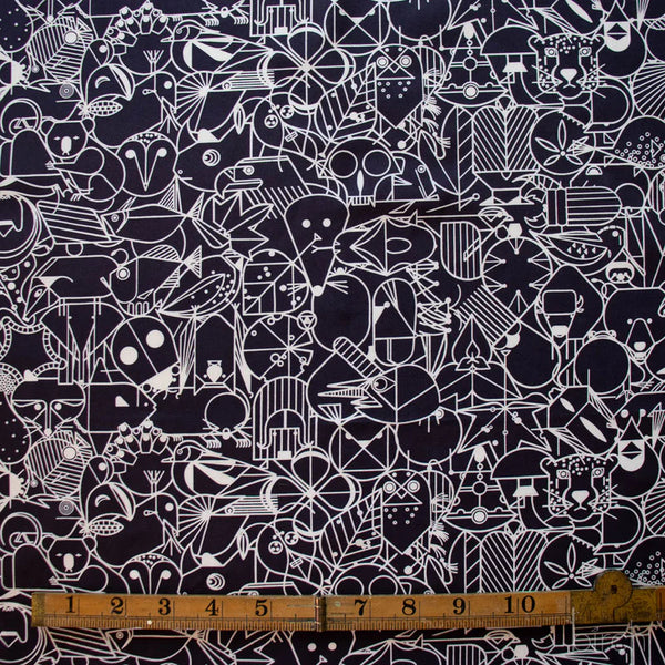 Scale of End Papers black organic cotton poplin fabric by Charley Harper for Birch Fabrics, featuring mid-century modern illustrations.