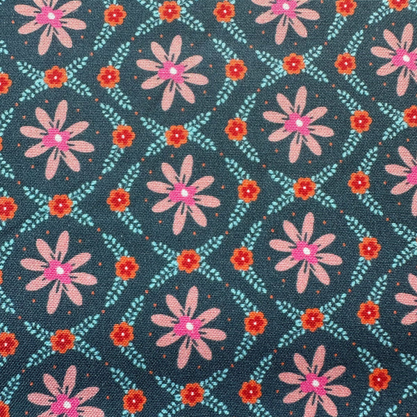 Close up of Fine Folk Daisy Chain cotton fabric by Helen Black, style FOLK1119