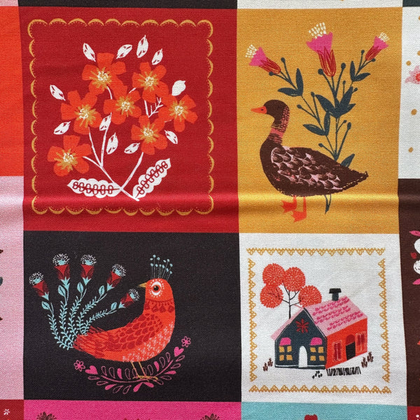 Close up of Fine Folk Quilted Folk cotton fabric by Helen Black, style FOLK1122