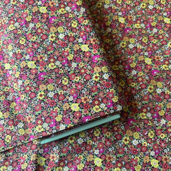 Bolt of Flownny Retro Floral cotton lawn fabric by Kokka in black multi, style NFA-1030-31 F