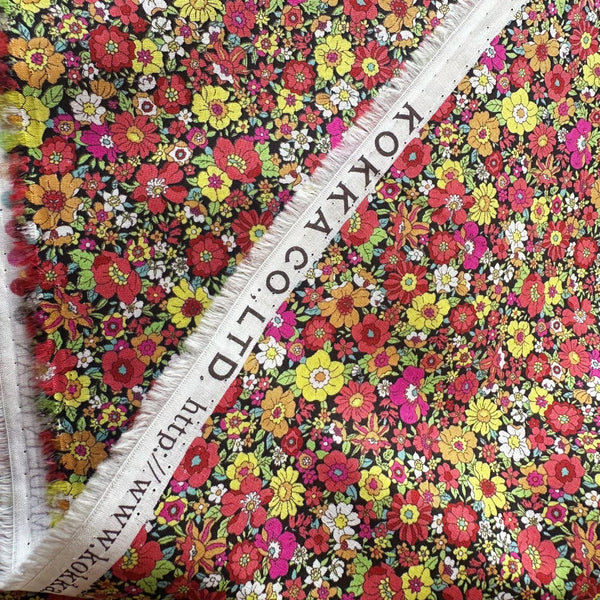 Selvage of Flownny Retro Floral cotton lawn fabric by Kokka in black multi, style NFA-1030-31 F