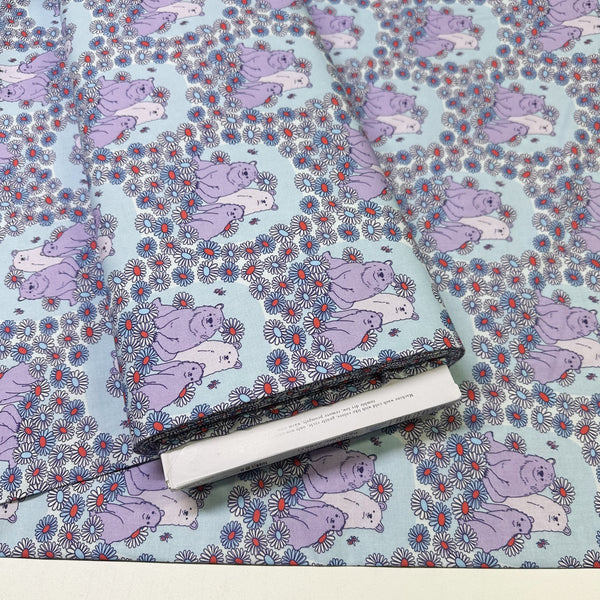Bolt of Forest Friends Daisy Bears Cotton Fabric by The Good Twin, blue and purple, 100% organic cotton.