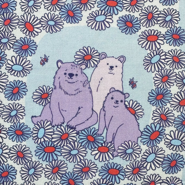 Close up of Forest Friends Daisy Bears Cotton Fabric by The Good Twin, blue and purple, 100% organic cotton.