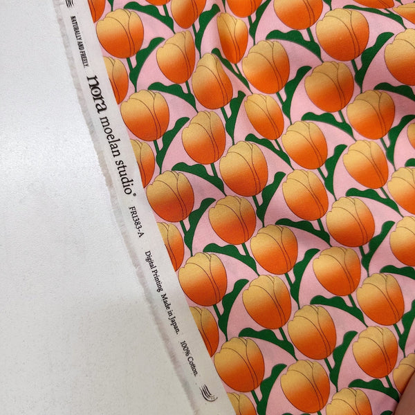 Selvage of Tulip cotton fabric by Nora in pink coral, fat quarter