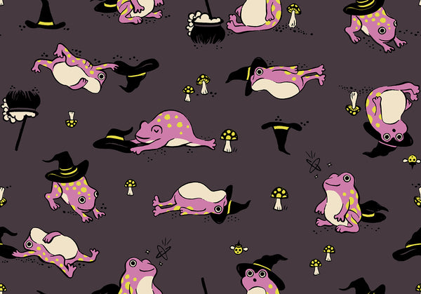 Frogmiliars cotton fabric by Ruby Star Society featuring frogs and witch hats on an eggplant purple background.