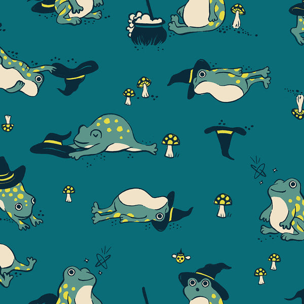 Frogmiliars cotton fabric by Ruby Star Society featuring frogs and witch hats on a teal background.