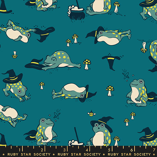 Scale of Frogmiliars cotton fabric by Ruby Star Society featuring frogs and witch hats on a teal background.