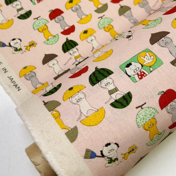 Bolt of Fruit Cats Canvas Fabric in Light Pink by Cotton Kobayashi – cats standing inside halved fruits on cotton linen canvas, imported from Japan