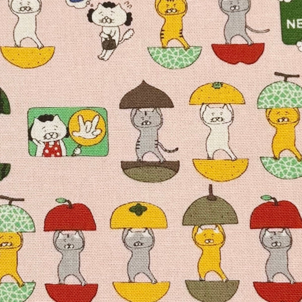 Close up of Fruit Cats Canvas Fabric in Light Pink by Cotton Kobayashi – cats standing inside halved fruits on cotton linen canvas, imported from Japan