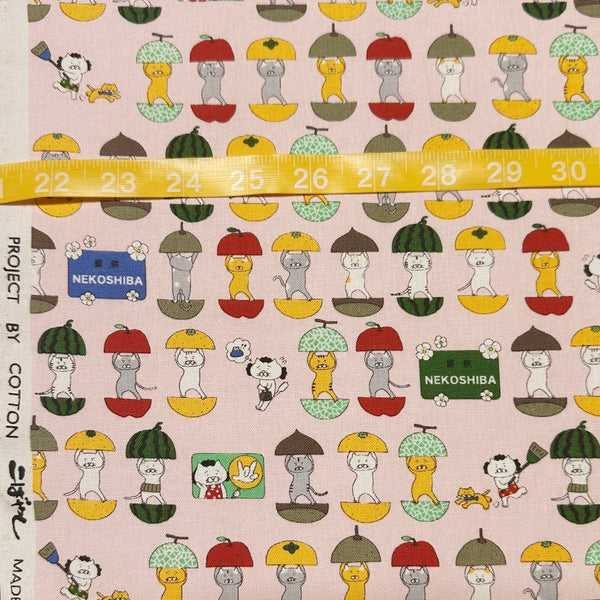 Scale of Fruit Cats Canvas Fabric in Light Pink by Cotton Kobayashi – cats standing inside halved fruits on cotton linen canvas, imported from Japan