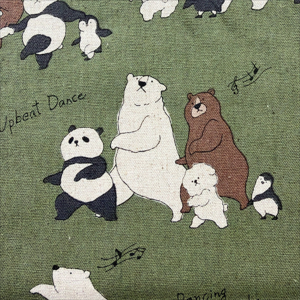 Close up of Funny Animals Bears and Friends cotton linen canvas fabric by Kokka in green, YKA-46030-1C