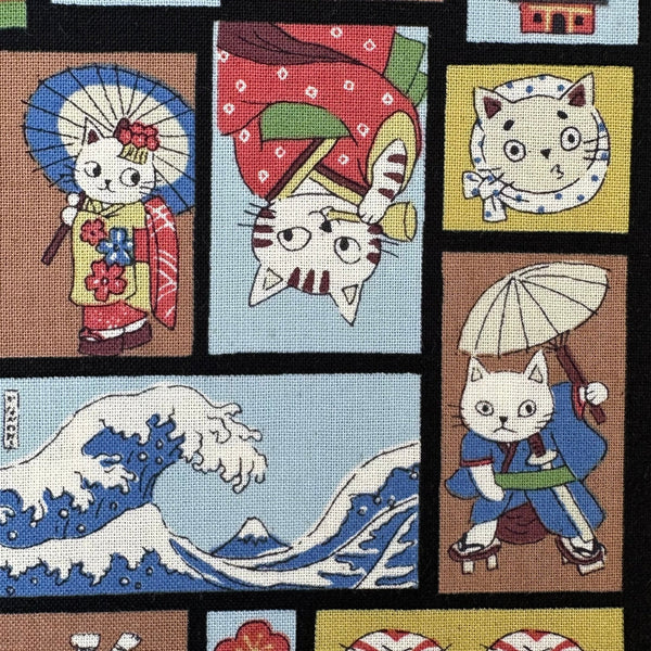 Close up of Funny Cats Woodblock Print cotton fabric by Kokka in black multi, style YKA-41060 1D