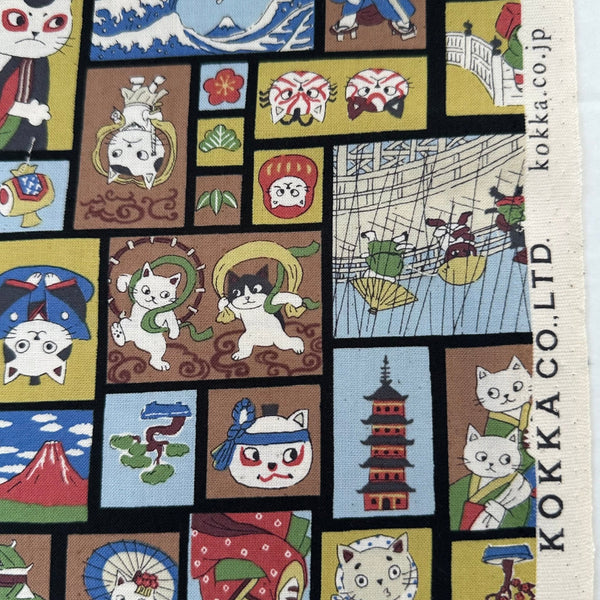Selvage of Funny Cats Woodblock Print cotton fabric by Kokka in black multi, style YKA-41060 1D