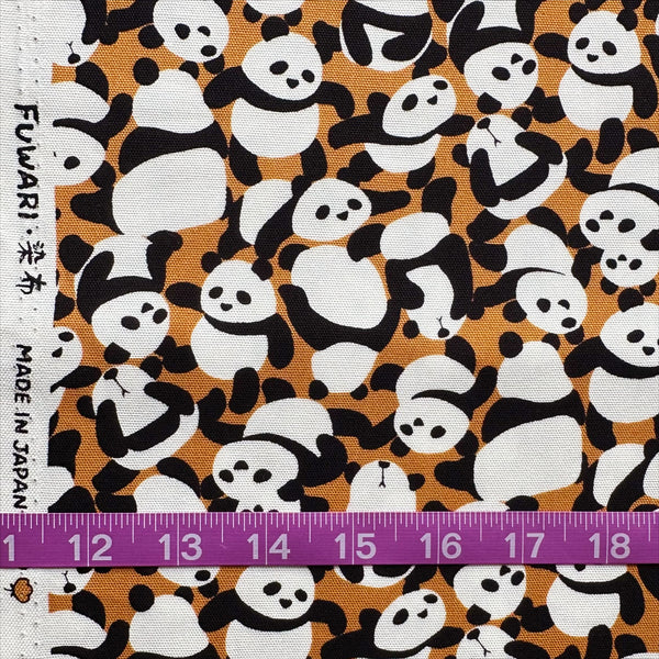 Scale of Packed Pandas cotton oxford fabric in caramel by Fuwari, Japanese import with allover panda print