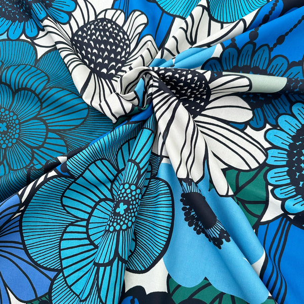 Drape of Garden Flowers cotton fabric by Kokka featuring oversized blue and black florals in a Scandinavian-inspired design
