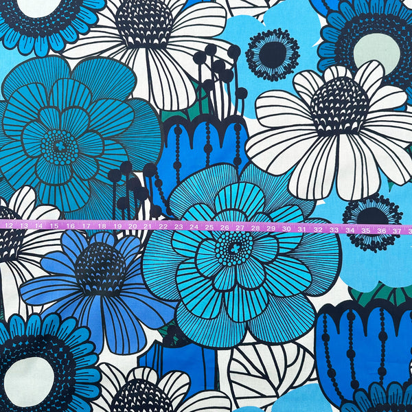 Scale of Garden Flowers cotton fabric by Kokka featuring oversized blue and black florals in a Scandinavian-inspired design