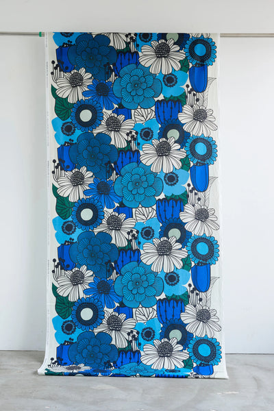 Stock photo of Garden Flowers cotton fabric by Kokka featuring oversized blue and black florals in a Scandinavian-inspired design