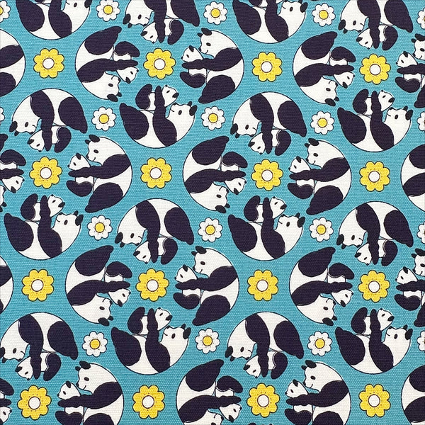 Goro Koro Panda Cotton Oxford Fabric in Blue by Anyan for Cotorienne and Yuwa featuring adorable rolling pandas on a blue background.