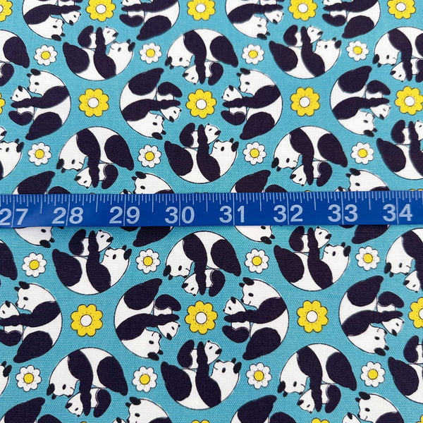 Scale of Goro Koro Panda Cotton Oxford Fabric in Blue by Anyan for Cotorienne and Yuwa featuring adorable rolling pandas on a blue background.