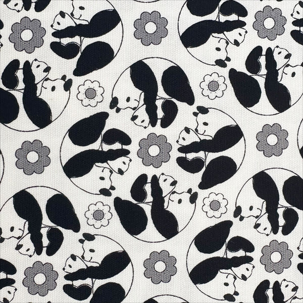 Close up of Goro Koro Panda Cotton Oxford Fabric in White by Anyan for Cotorienne and Yuwa featuring adorable rolling pandas on a white background.