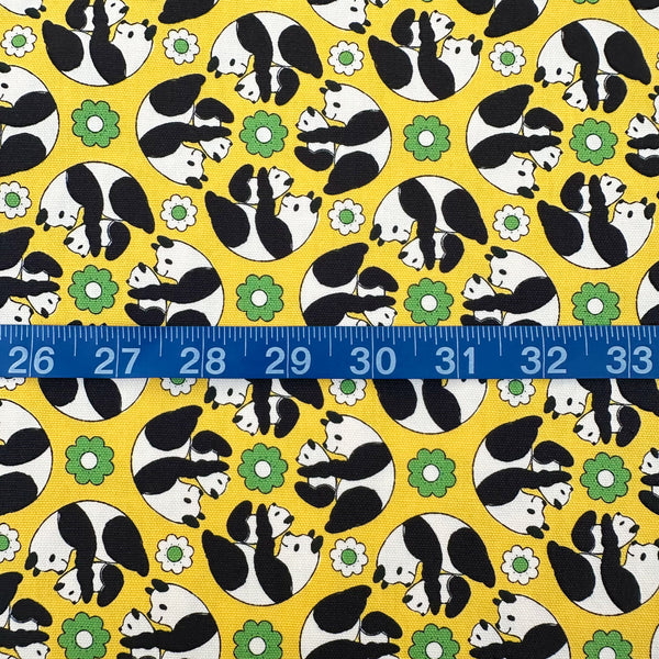 Scale of Goro Koro Panda Cotton Oxford Fabric in Yellow by Anyan for Cotorienne and Yuwa featuring adorable rolling pandas on a yellow background.