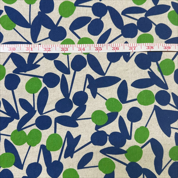 Scale of Green Cherry Pom Pom canvas fabric by Sevenberry, cotton linen blend