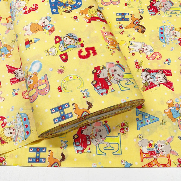 Bolt of Happy Baby cotton fabric by Yuwa in yellow, AT822366 C