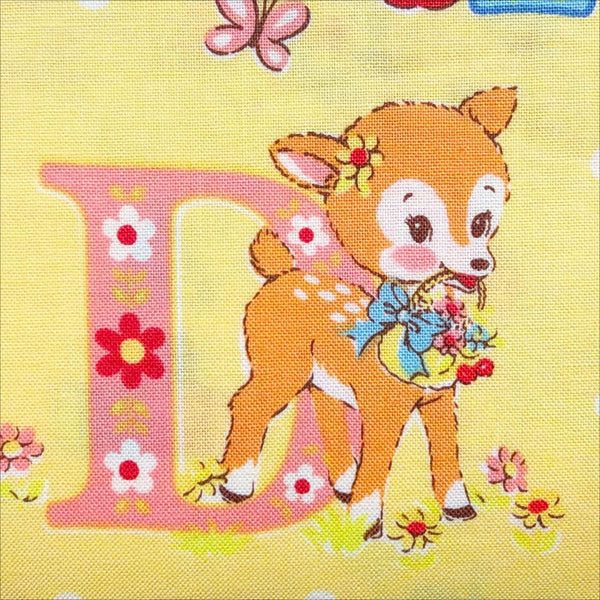 Close up of Happy Baby cotton fabric by Yuwa in yellow, AT822366 C