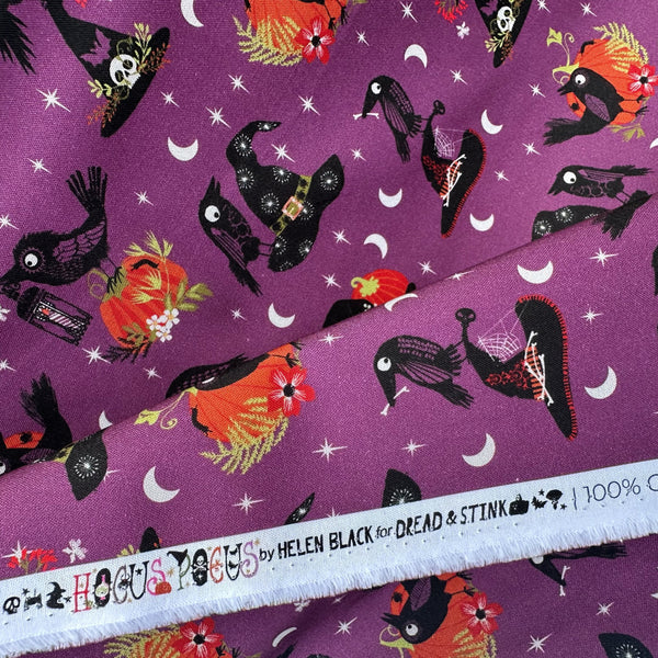 Selvage of Hocus Pocus Beaks and Brims cotton fabric by Helen Black featuring crows and witch hats on a black Halloween background