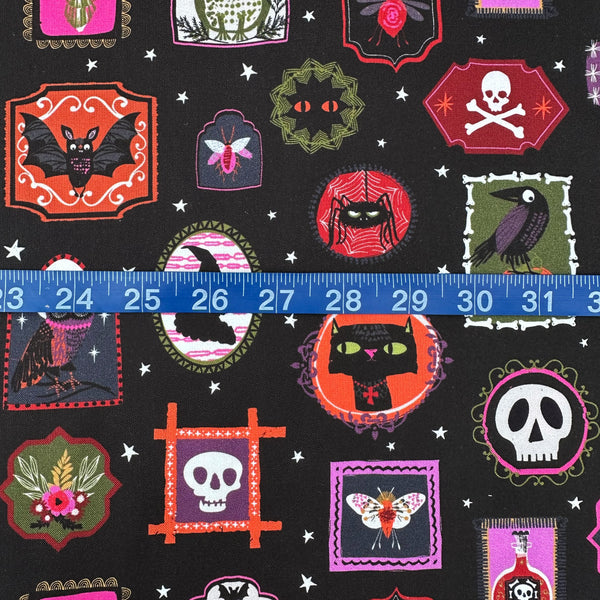 Scale of Hocus Pocus Ghoulish Gallery cotton fabric by Helen Black featuring spooky framed portraits on a black background