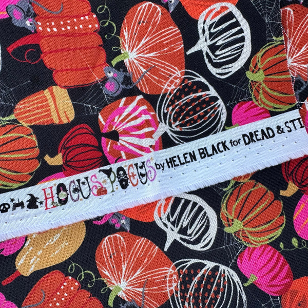 Selvage of Hocus Pocus Pumpkin Patch cotton fabric by Helen Black featuring charming pumpkins and cute mice on a black background