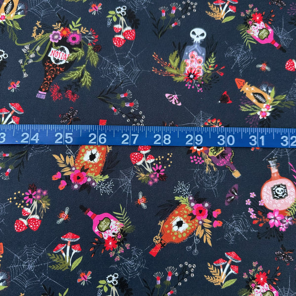 Scale of Hocus Pocus Spellbound cotton fabric by Helen Black featuring potion bottles, spider webs, and mushrooms on a black background