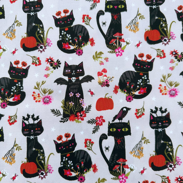 Hocus Pocus Witchy Whiskers cotton fabric by Helen Black featuring cats, bats, and pumpkins on a beige background
