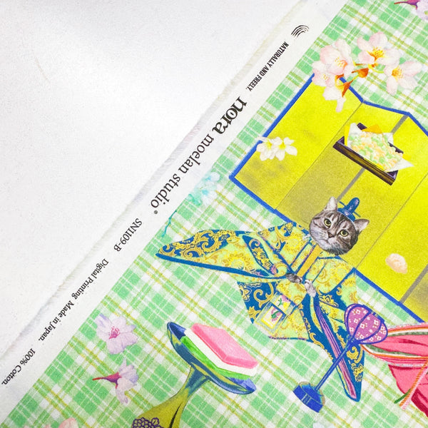 Selvage of Imperial Court Cats cotton fabric in green by Nora – vibrant photo-real cats dressed as emperors and empresses on quilt weight cotton