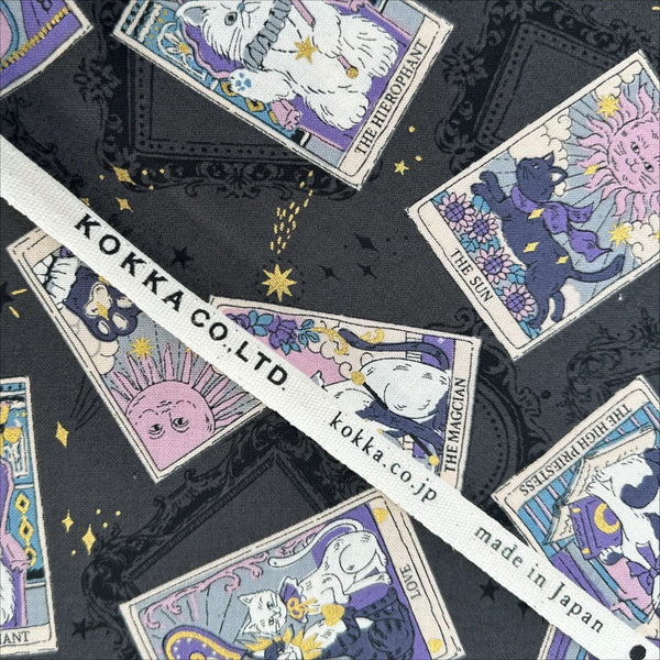 Selvage of In the Darkness Tarot Cats cotton fabric by Kokka in gray, YGA-91050 E