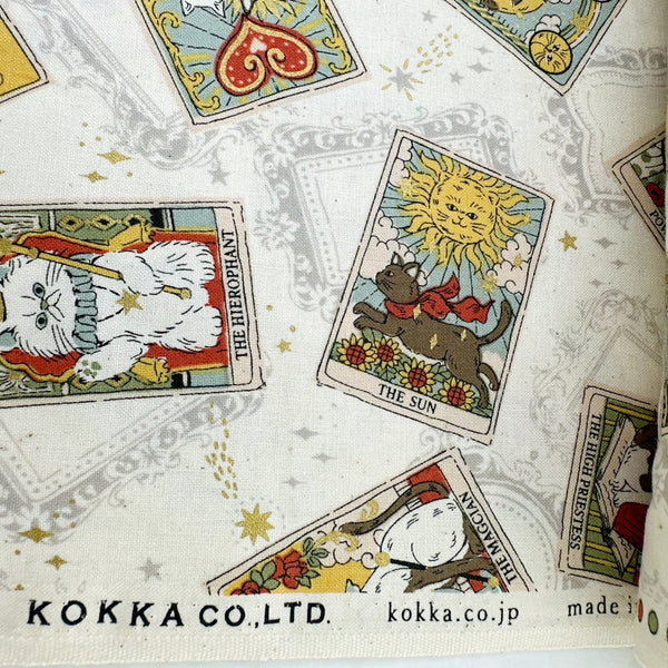 Selvage of In the Darkness Tarot Cats cotton fabric by Kokka in ivory, YGA-91050 A