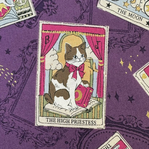 Close up of In the Darkness Tarot Cats cotton fabric by Kokka in purple, YGA-91050 C