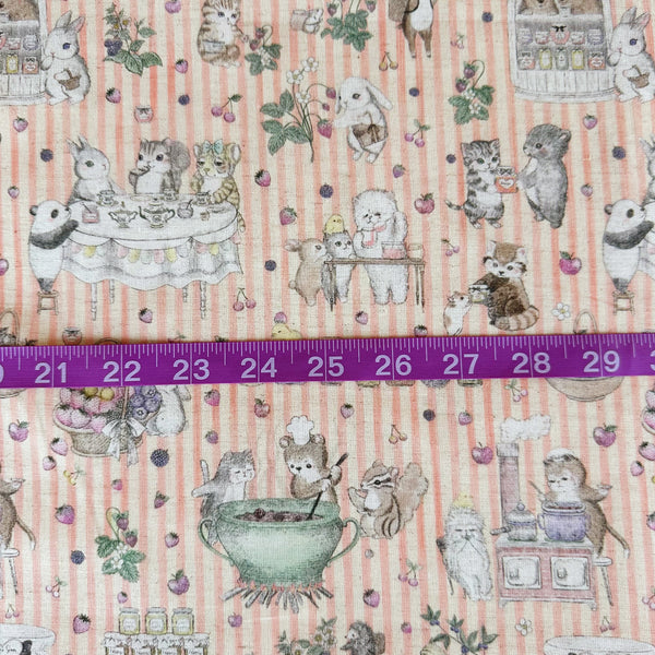 Scale of Jam Lab cotton linen fabric by Yukiemon for Hokkoh featuring a whimsical critter tea party with animals making jam on a pink striped background, imported from Japan