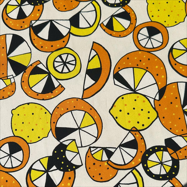 Cotton oxford fabric featuring a lemon and lime print in yellow and green on a natural background, Imported from Japan
