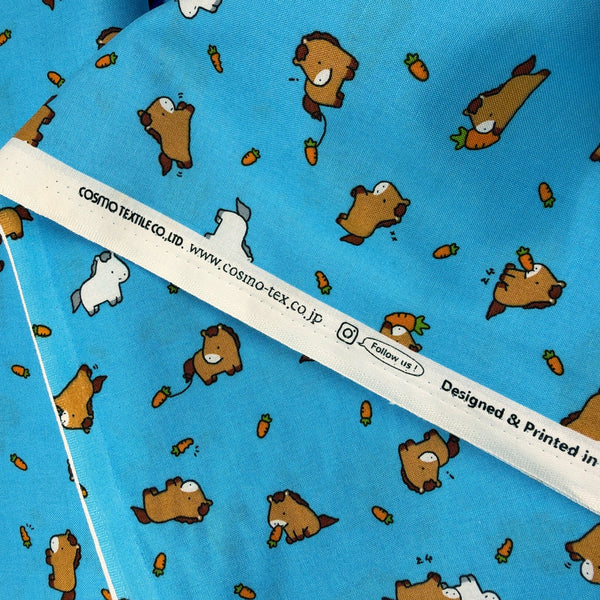 Selvage of Kawaii Horses cotton fabric by Cosmo Textiles in sky blue, AP55104 1D