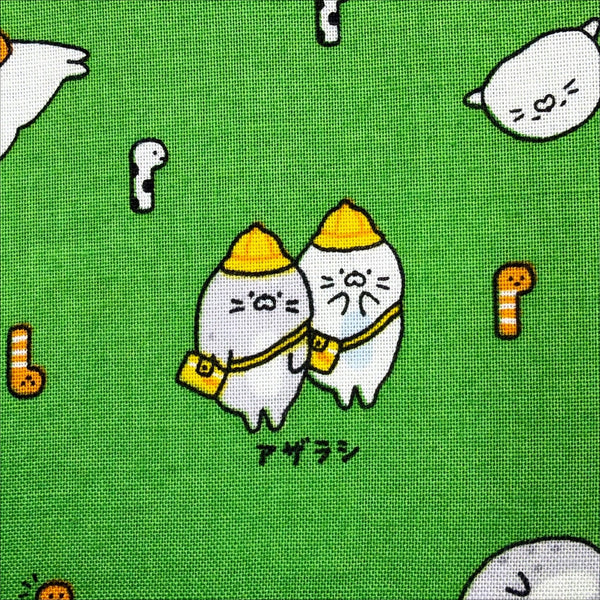 Close up of Kawaii Seals cotton fabric by Cosmo Textiles in green, AP61103 2E