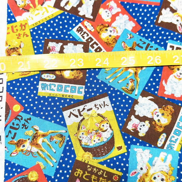 Scale of KoroKoro Animal Picture Books Cotton Fabric in Blue by Koko Seki – quilt-weight cotton with retro animal storybook designs and Japanese text